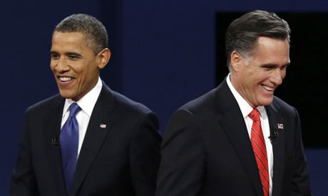 President Barack Obama walks past Republican presidential nominee Mitt Romney during the first presidential debate. Photograph: AP