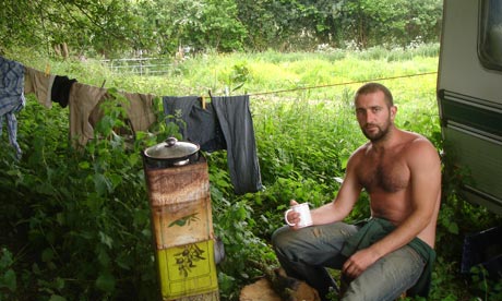 Mark Boyle outside his off-grid caravan. Photograph: Mark Boyle