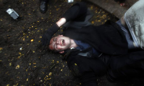 Occupy Wall Street protester Brandon Watts lies injured on the ground after clashes with police over the eviction of OWS from Zuccotti Park. Photograph: Allison Joyce/Getty Images