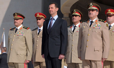 Bashar Assad and Syrian generals at a ceremony to mark the 38th anniversary of the October 1973 Arab-Israeli war. Photograph: Ho/AP