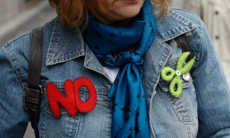 A demonstrator wears a 'no cuts' badge in Madrid. Photograph: Andrea Comas/Reuters