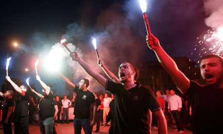 Supporters of the far right Golden Dawn party celebrate their success in elections, in Thessaloniki, northern Greece. Photograph: Grigoris Siamidis/Reuters