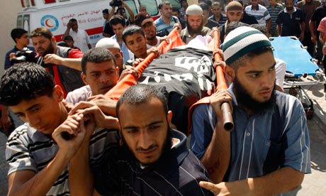 The funeral of Ghaleb Armilat, who was killed in an Israeli airstrike, takes place in Gaza. Photograph: Ibraheem Abu Mustafa/Reuters