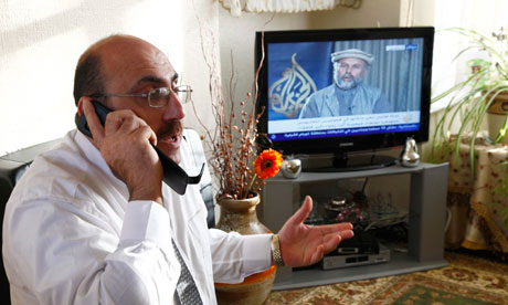 The director of the Syrian Observatory for Human Rights, Rami Abdulrahman, speaks on the phone in his home in Coventry on December 6, 2011.  Photograph: Reuters