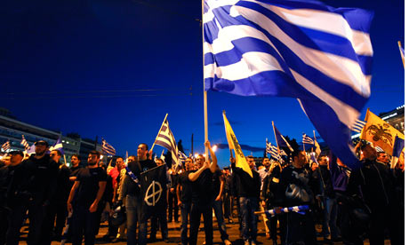 Supporters of the extreme-right Golden Dawn party sing the national anthem during a rally.   Photograph: Yorgos Karahalis/Reuters