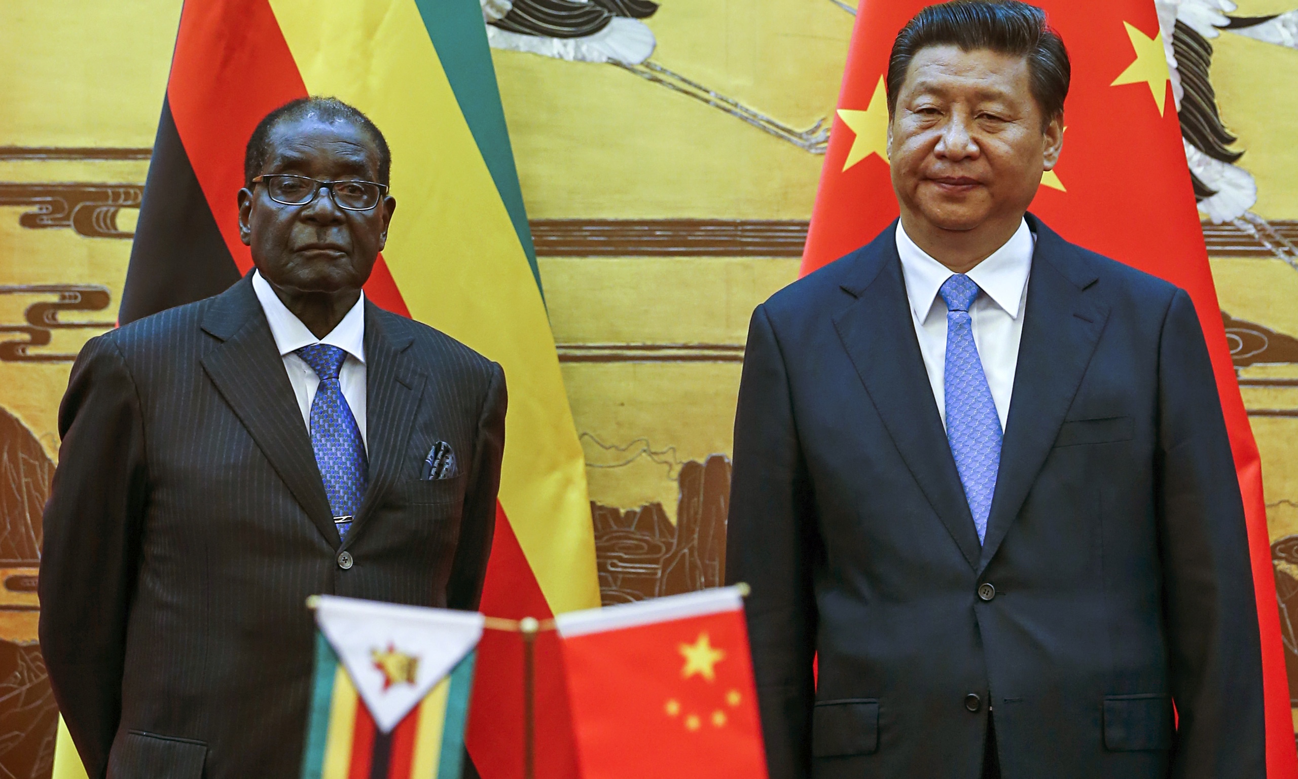 Robert Mugabe visits China as critics condemn 'desperate' bid for ...