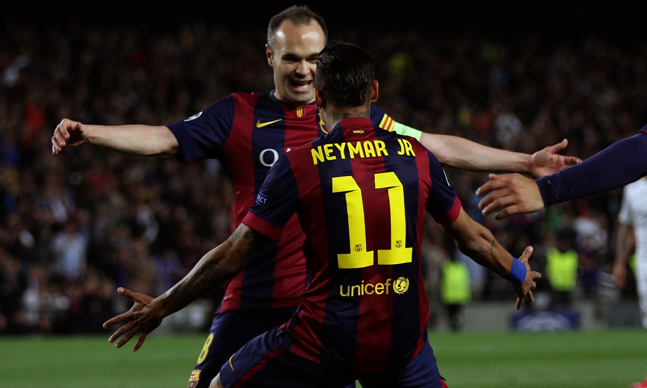 Neymar celebrates his opener in the Champions League quater-final second leg against PSG, with Andrés Iniesta.