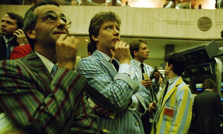 Traders on the London Stock Exchange watch the screens in the post-Big Bang 1980s. Photograph: Tom Stoddart Archive/Getty Images